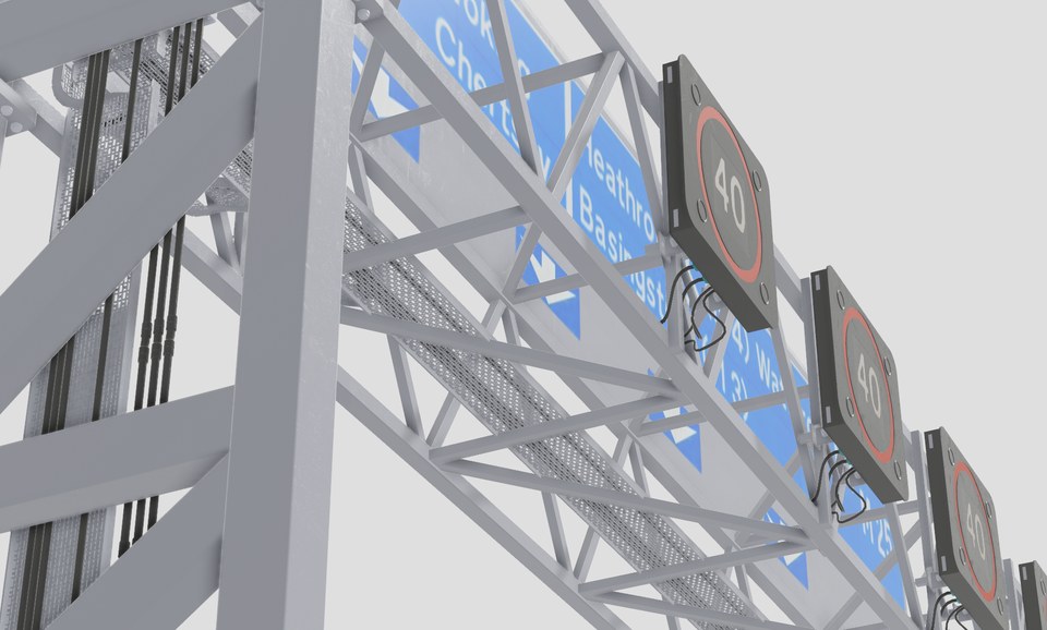 Underneath a motorway gantry showing structural bracing and variable-speed displays