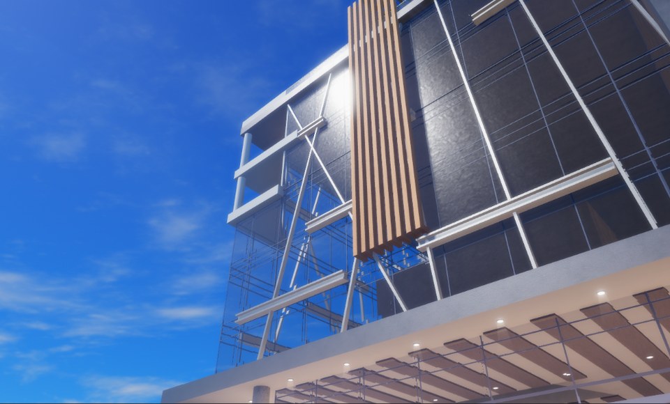 Low angle of a modern building façade with glazing, diagonal bracing and blue sky
