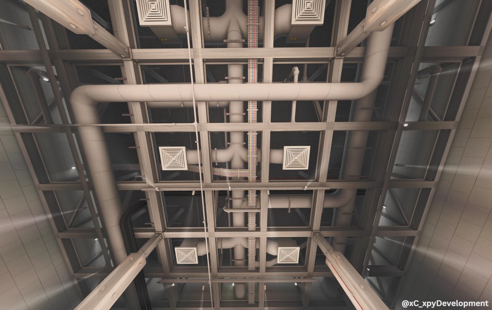 Upward view of symmetrical ceiling framing, columns and exposed building services