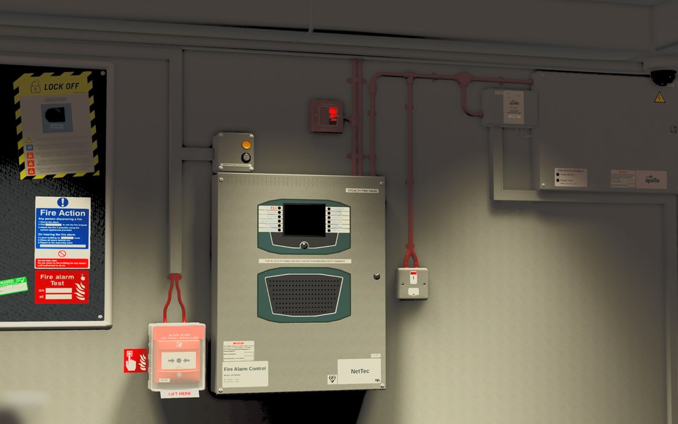 Front view of ride operator wall-mounted controls, equipment and safety notices