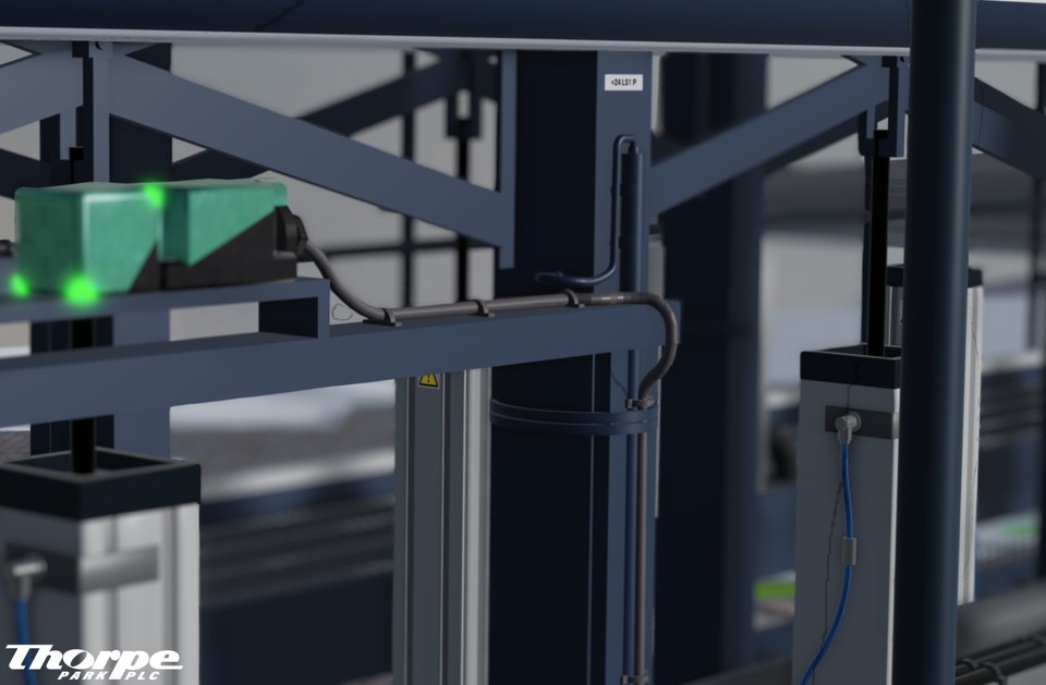 Coaster station mechanism framed by dark steel columns and cross braces